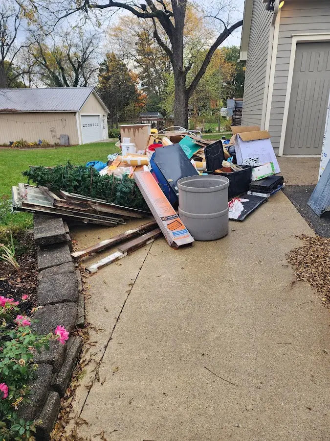 Dumpster being loaded with debris for 30 Yard Dumpster Rental in Rupert